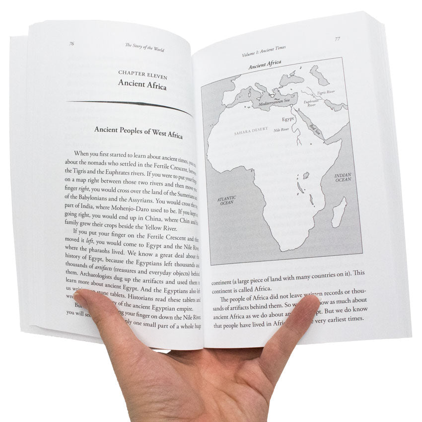 A hand holding open The Story of the World, Volume 1, Ancient Times to show inside pages. The left page has the title “Ancient Africa, Ancient Peoples of West Africa” at the top with text below. On the right page Is a map of Ancient Africa with some text below.